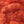 Close up of Textreme Fab-ulous Chenille Synthetic Fly Tying Chenille in fluorescent fire orange.