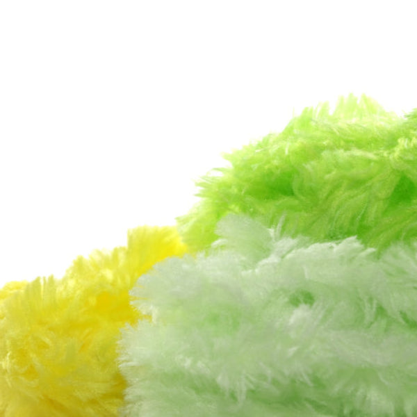 Several clumps of Textreme Fab-ulous Chenille Synthetic Fly Tying Chenille in yellow, white and chartreuse, on a white background.