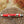 A Ty-Rite EZ Ty Hook Holder, model Senior, placed on a wooden surface with a blurred background.