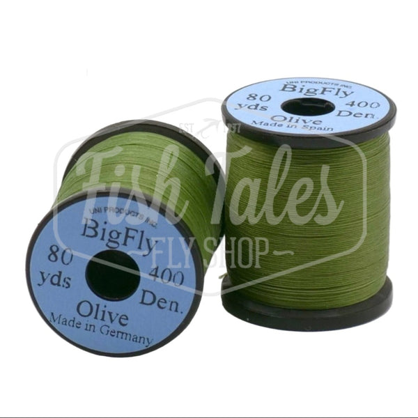 Two spools of olive UNI Big Fly fly tying thread on a white background.