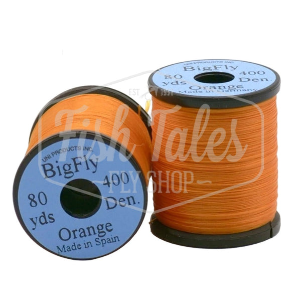Two spools of orange UNI Big Fly fly tying thread on a white background.