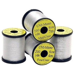 Group of 4 spools of UNI Mono Fly Tying Thread on a white background