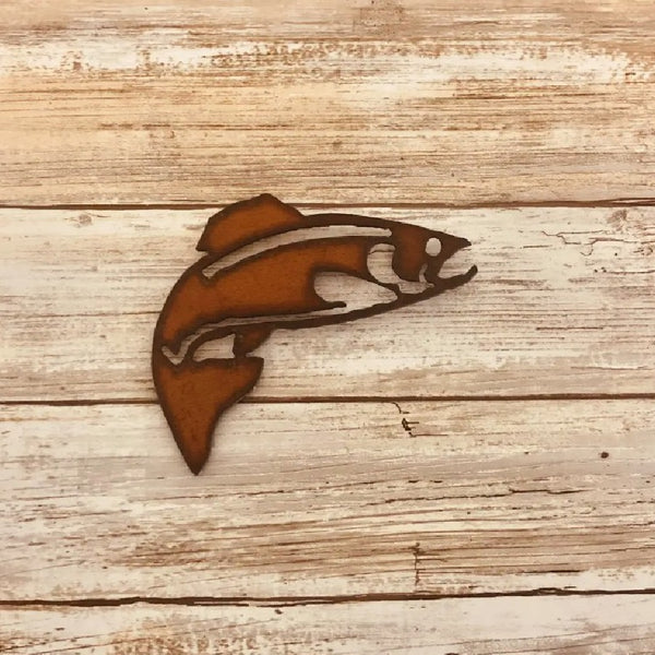 Metallic brown Universal Ironworks Rustic Trout Magnet, on a light wooden background.