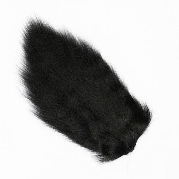 A dyed black Veniard Doe Tail for fly tying on a white background.