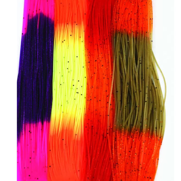 Skeins of various colors of Fire Tip Wapsi Sili Legs for fly tying shown laid out next to each other vertically on a white background.