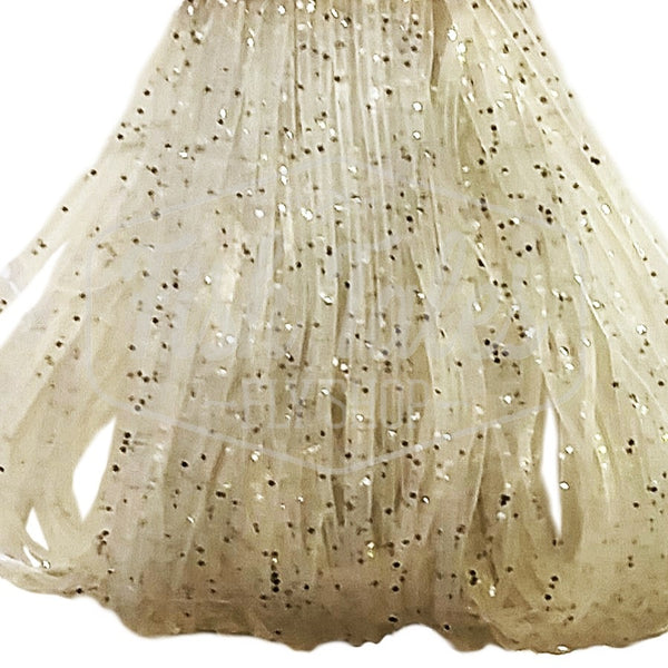 Clear with pearl and black Speckled Flake Wapsi Sili Legs for fly tying shown close up on a white background.