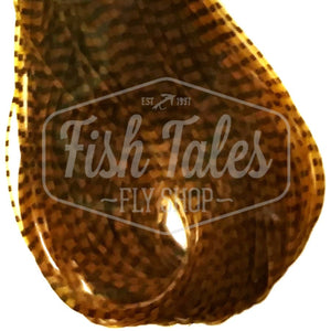 Pumpkin and black Perfectly Barred Nymph Size Wapsi Sili Legs for fly tying shown close up on a white background.