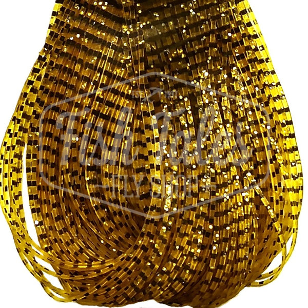 Amber and black Perfectly Barred Wapsi Sili Legs for fly tying shown close up on a white background.