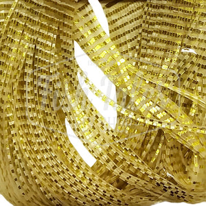 Gold and clear Chrome Perfectly Barred Wapsi Sili Legs for fly tying shown close up on a white background.