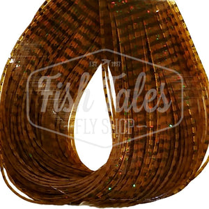 Pumpkin and black Perfectly Barred Wapsi Sili Legs for fly tying shown close up on a white background.