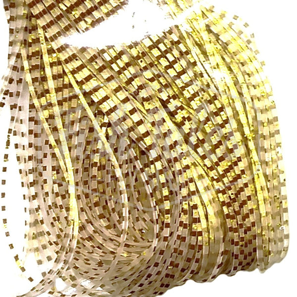 Sand color Perfectly Barred Wapsi Sili Legs for fly tying shown close up on a white background.