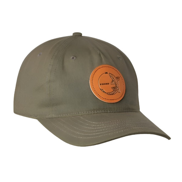 front view of a single sage chasing trout full cloth ball cap in olive showing round leather patch with trout and sage logo on a white background