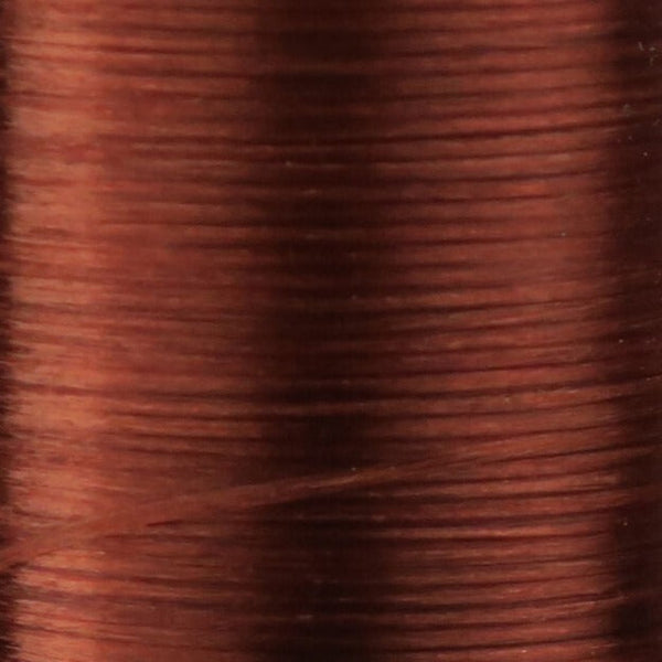 Close up of brown Danville Flat Waxed Nylon fly tying thread.