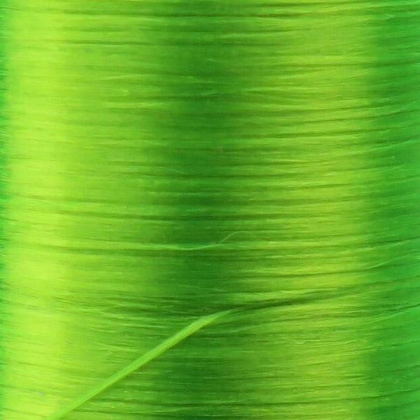 Close up of fluorescent green Danville Flat Waxed Nylon fly tying thread.