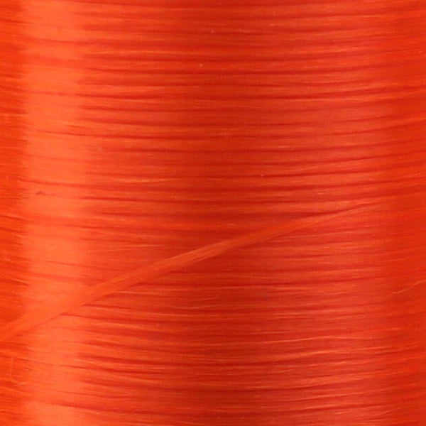 Close up of fluorescent orange Danville Flat Waxed Nylon fly tying thread.