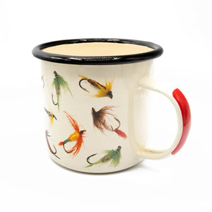 a single white enamel mug with black rim and various flies printed on a white background