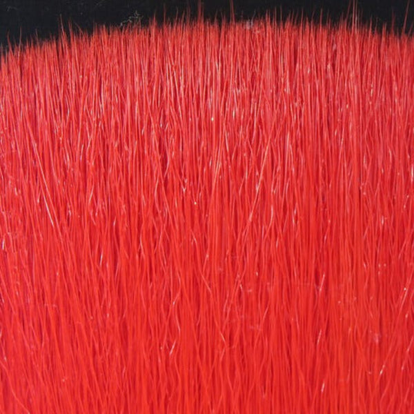Close-up of red Fly Men Fish Skull Faux Bucktail synthetic fly tying material.