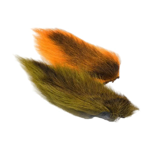 Two dyed Hook and Hackle Whole Bucktail for fly tying in olive green and orange shown side by side, on a white background.