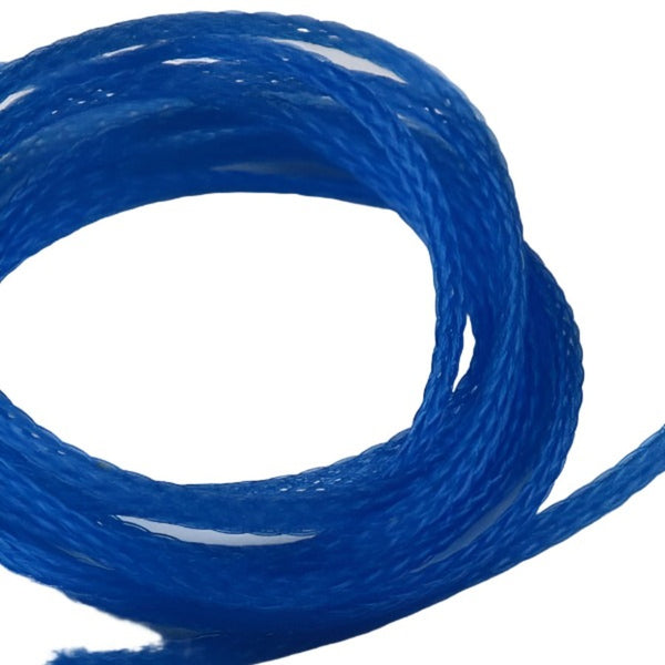 closeup of coiled blue hareline adult damsel body material for fly tying on white background