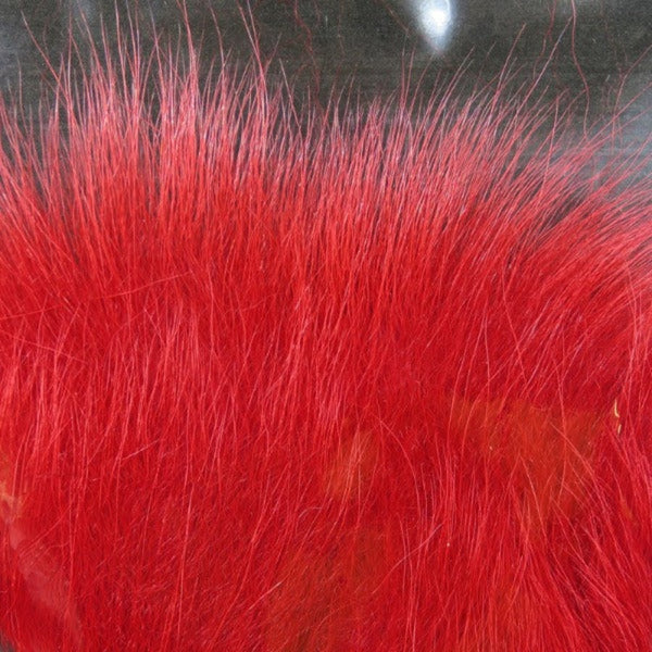 Close up of dyed red arctic fox tail fur used for fly tying.