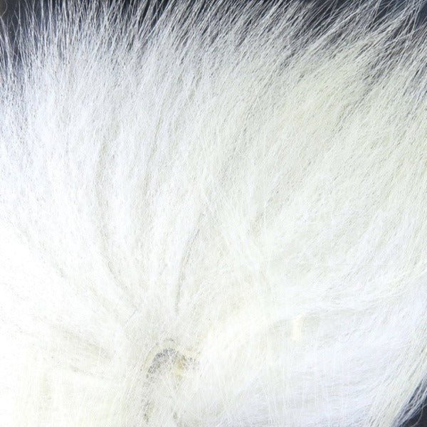 Close up of natural white arctic fox tail fur used for fly tying.