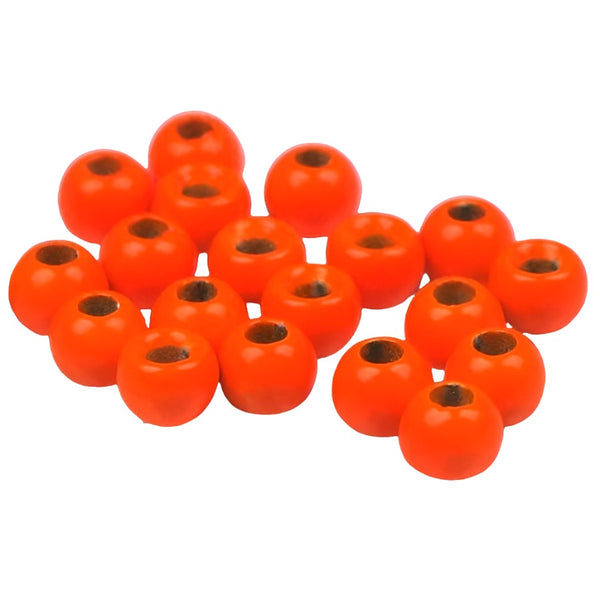 A large group of orange cyclops tungsten beads for fly tying on a white background.