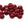 A large group of metallic red cyclops tungsten beads for fly tying on a white background.