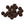 A large group of mottled brown cyclops tungsten beads for fly tying on a white background.