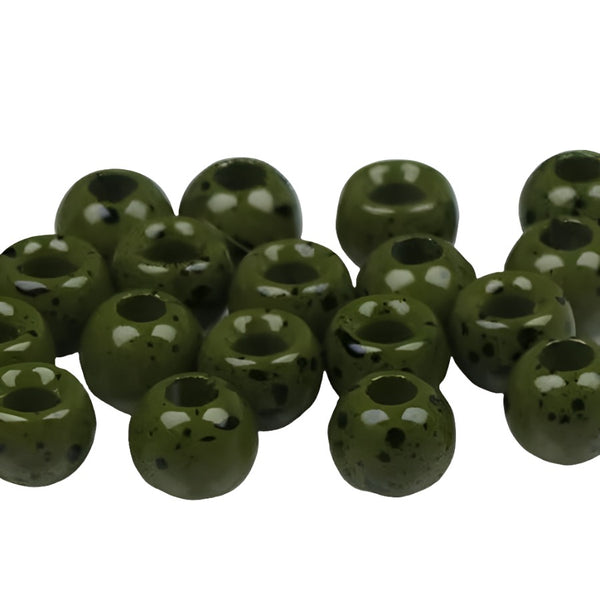 A large group of mottled olive cyclops tungsten beads for fly tying on a white background.