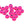 A large group of pink cyclops tungsten beads for fly tying on a white background.