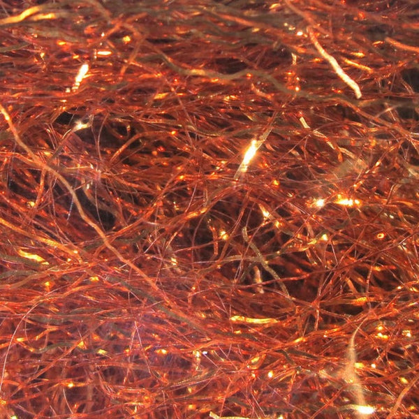 A close-up image of copper Hareline Ripple Ice Fiber, showing the shiny and characteristically crinkled strands.