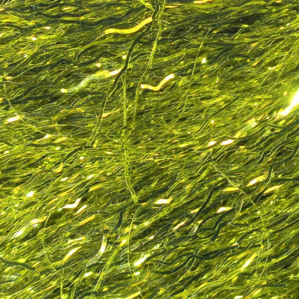 A close-up image of light olive Hareline Ripple Ice Fiber, showing the shiny and characteristically crinkled strands.