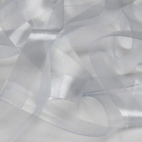 Clear color strip of semi-transparent and stretchy Hareline Scud Back fly tying body material, on a white background.