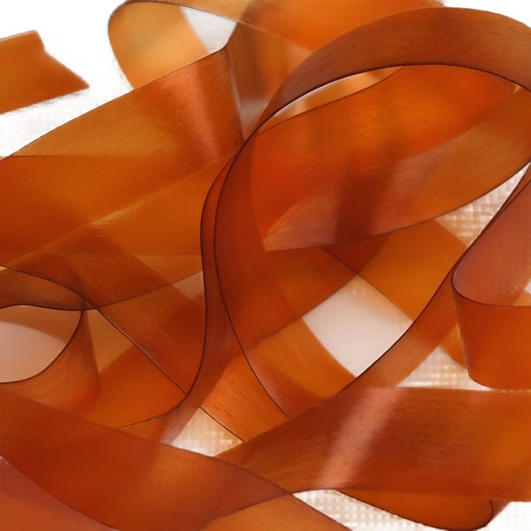 Summer duck color strip of semi-transparent and stretchy Hareline Scud Back fly tying body material, on a white background.