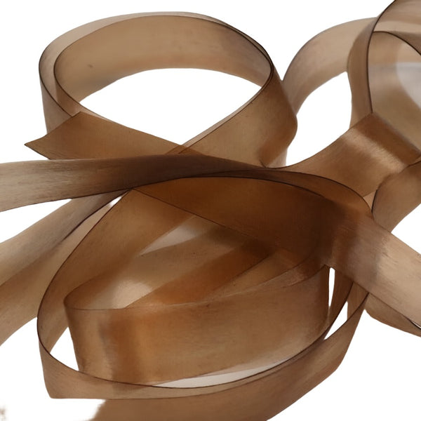 Tan color strip of semi-transparent and stretchy Hareline Scud Back fly tying body material, on a white background.