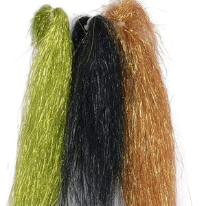 three skeins of angel hair fly tying flash material in olive, black, and copper gold on a white background