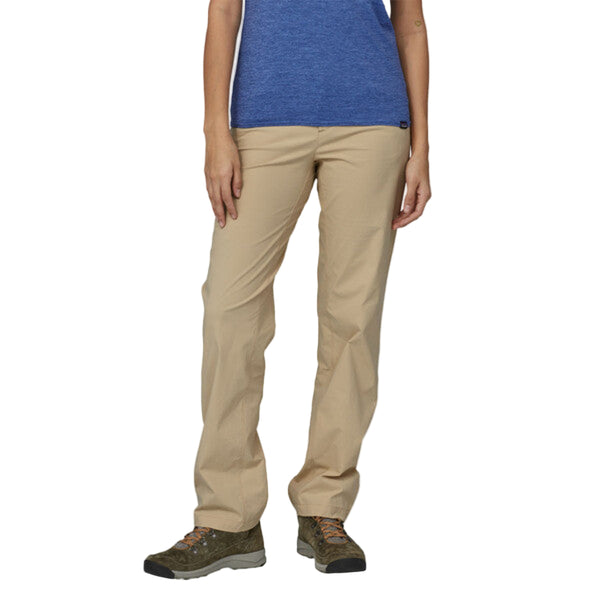 Person wearing husk tan Patagonia Women's Quandary Pant on a white background.