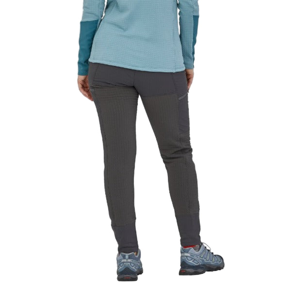 Person wearing Patagonia Women's R2 TechFace Pants in gray color on a white background.