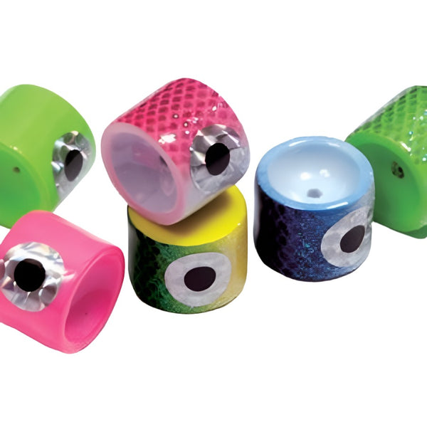 A close up view of a group of multicolored rainys big eye poppin heads for fly tying on a white background.