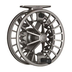 Sand color Redington Run Fly Reel showing the handle side on a white background.
