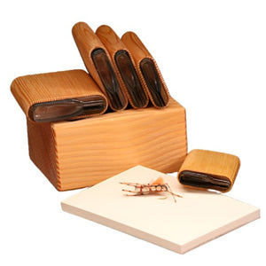 A selection of several sizes of River Road Creations Fat Albert Foam Body Cutters, shown with the cutting pad and an example Fat Albert Foam Dry Fly, against a white background. 