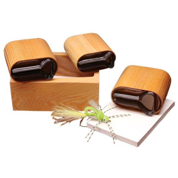 A selection of several sizes of River Road Creations Stealth Bomber Foam Body Cutters, shown with the cutting pad and an example stealth bomber fly, against a white background. 