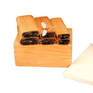 A set of River Road Creations Foam Mayfly Wing Cutters, shown with the cutting pad and an example Rusty Spinner mayfly dry fly, against a white background. 
