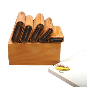 A set of 5 different sized River Road Creations Hopper/Caddis/Ant Body Foam Cutters showing the wooden caddy, cutting pad, and an example completed foam fly against a white background.