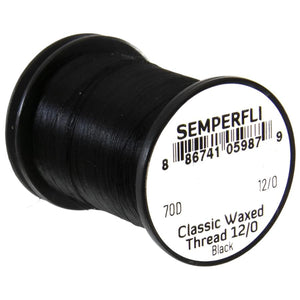 A single spool of black semperfli classic waxed thread used for fly tying on a white background