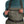 A person facing forward wearing Simms Women's Tributary Stockingfoot Waders zoomed in on the front pocket on a white background.