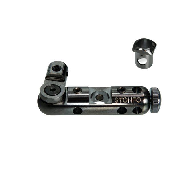 A black nickle Stonfo joint block fly tying accessory with an 8 mm adaptor bushing shown on a white background.
