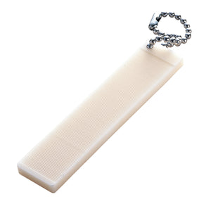 An off-white Tiemco Ceramic Hook Hone with bead chain attachment, showing the serrated side for filing and sharpening large hooks, on a white background.