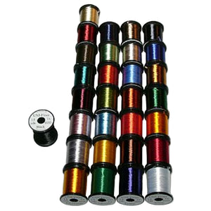 A collection of spools of UNI-Floss in various colors for fly-tying purposes on a white background.