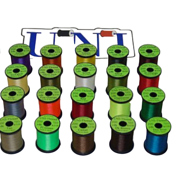 A collection of spools of UNI Standard Fly Tying Thread 8/0 in various colors arranged on a white background.